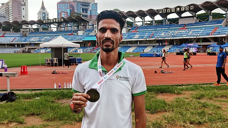 Gulveer Singh with his medal at the National Open Athletics Championships. - Photo: X | nnis Sports